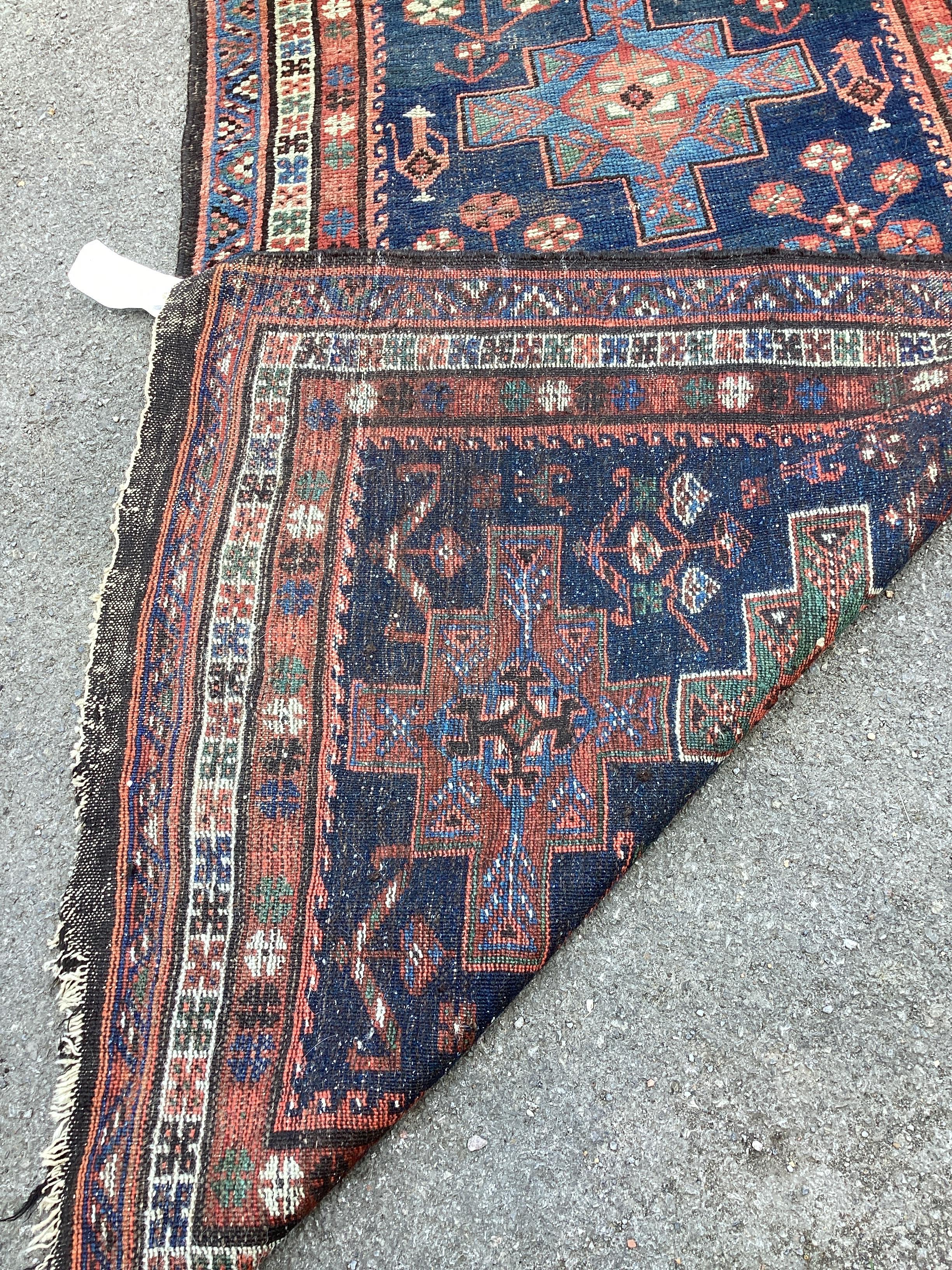 An antique South West Persian blue ground Luri runner, 291 x 114cm